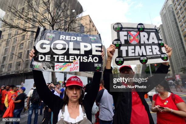 Members of the Roofless Movement call for Brazilian President Michel Temer to step down and protest against his proposed economic reforms, at...