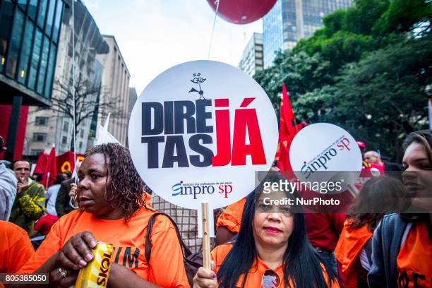 Members of the Roofless Movement call for Brazilian President Michel Temer to step down and protest against his proposed economic reforms, at...