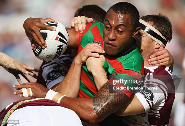 Roy Asotasi of the Rabbitohs is tackled by the Sea Eagles defence during the round four NRL match between the Manly Warringah Sea Eagles and the...