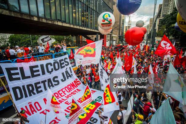 Members of the Roofless Movement call for Brazilian President Michel Temer to step down and protest against his proposed economic reforms, at...