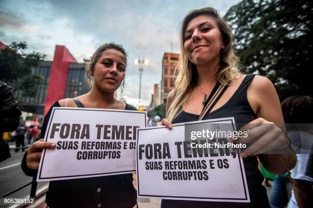 Members of the Roofless Movement call for Brazilian President Michel Temer to step down and protest against his proposed economic reforms, at...
