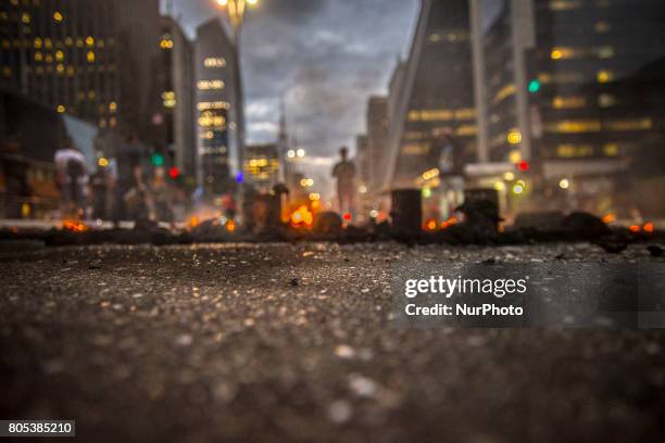 Members of the Roofless Movement call for Brazilian President Michel Temer to step down and protest against his proposed economic reforms, at...