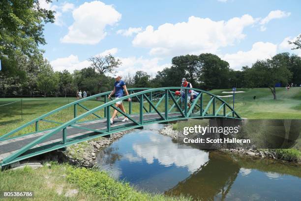 Stacy Lewis crosses a bridge with her caddie Travis Wilson on the 15th hole during the third round of the 2017 KPMG Women's PGA Championship at...