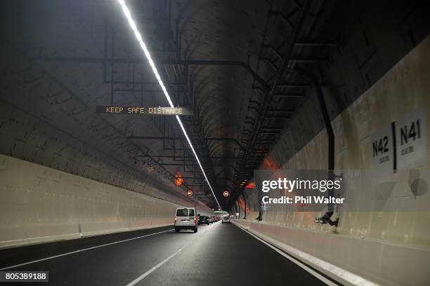 Vehicles drive through the Waterview Tunnel after it opened to traffic on July 2, 2017 in Auckland, New Zealand. New Zealand longest tunnel...