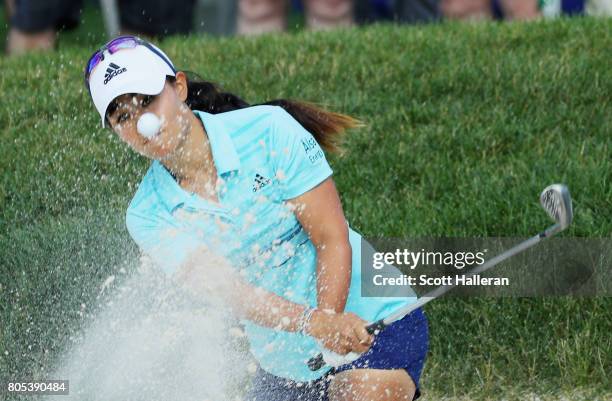 Danielle Kang plays a bunker shot on the 18th hole during the third round of the 2017 KPMG Women's PGA Championship at Olympia Fields Country Club on...