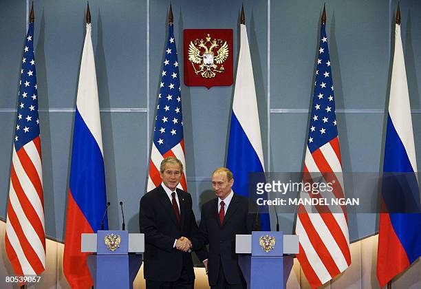 President George W. Bush and Russian President Vladimir Putin shake hands following a joint press conference on April 06, 2008 at the State Residence...