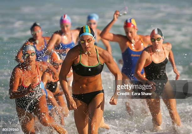 Jade Neilsen of Burleigh Heads Mowbray Park leads a pack of competitors out of the water on her way of finishing third in the under-17 womens surf...