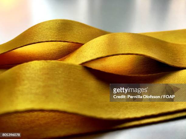 yellow ribbon - yellow ribbon stock pictures, royalty-free photos & images