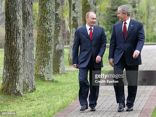 Russian President elect Dimitry Medvedev and US President George W. Bush talk during a bilateral meeting at the President's summer retreat Docharov...