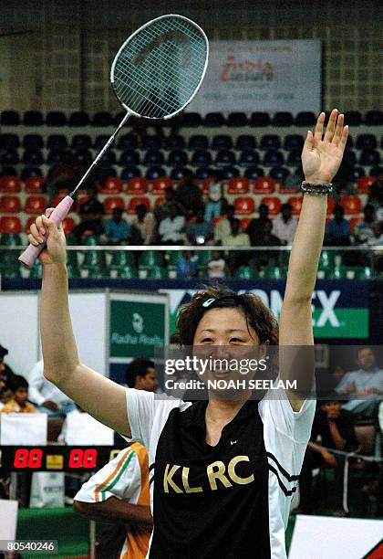 Hong Kong's Badminton player Zhou Mi celebrates after winning the women's single final of the Indian Open gold Grand Prix 2008 against Lu Lan from...