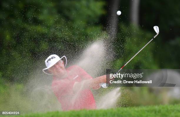 Kirk Triplett hits from the sand on the 14th hole during the third round of the 2017 U.S. Senior Open Championship at Salem Country Club on July 1,...