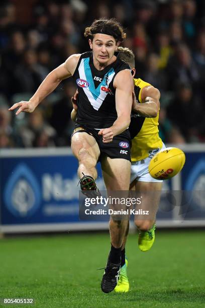 Darcy Byrne-Jones of the Power kicks the ball during the round 15 AFL match between the Port Adelaide Power and the Richmond Tigers at Adelaide Oval...