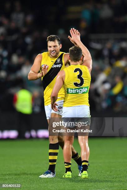 Toby Nankervis celebrates with Brett Deledio of the Tigers during the round 15 AFL match between the Port Adelaide Power and the Richmond Tigers at...