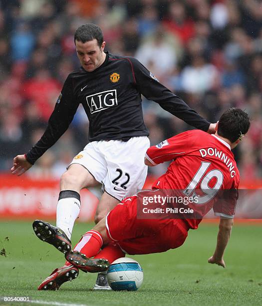 John O'Shea of Manchester United tangles with Stewart Downing of Middlesbrough during the Barclays Premier League match between Middlesbrough and...