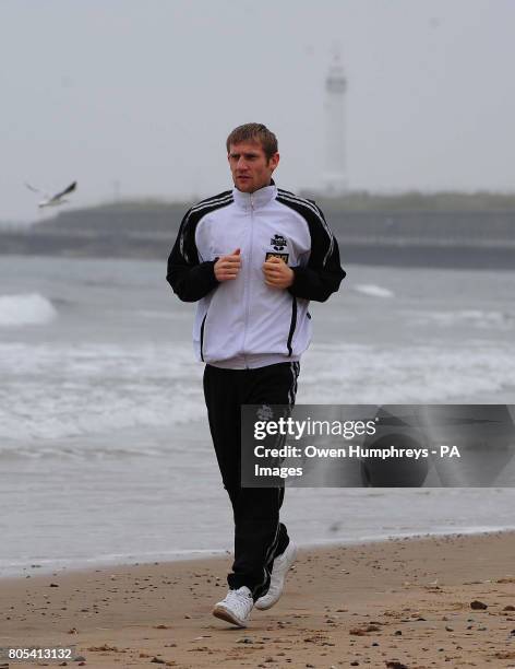 Tony Jeffries takes a jog along the beach in Seaburn, Sunderland.