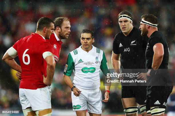 Referee Jerome Garces talks to Alun Wyn Jones and Sam Warburton of the Lions and Brodie Retallick and Kieran Read of the All Blacks during the...