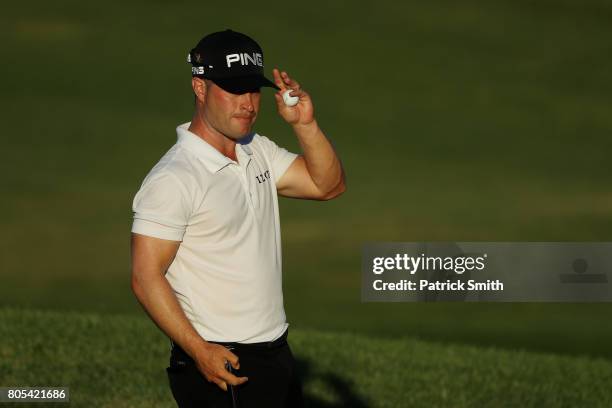 David Lingmerth of Sweden reacts after finishing on the 18th green during the third round of the Quicken Loans National on July 1, 2017 TPC Potomac...