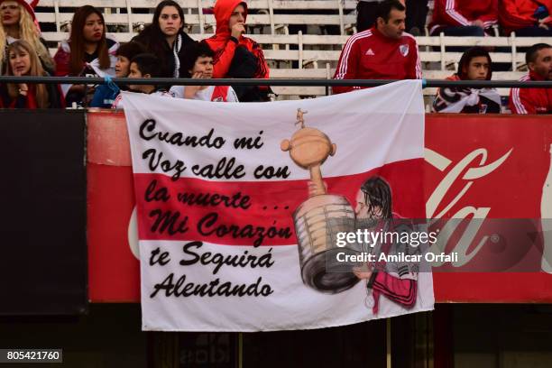 Fans display a flag with a message for Argentinian soccer player Fernando Cavenaghi prior the Fernando Cavenaghi's farewell match at Monumental...