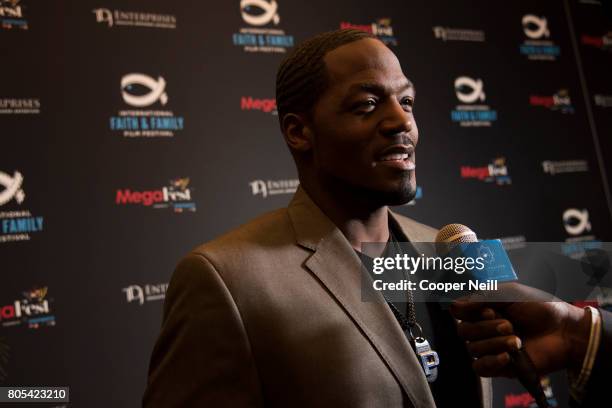 Stallings visits with the media poses before a screening of 'A Question of Faith' during the MegaFest International Faith & Family Film Festival at...
