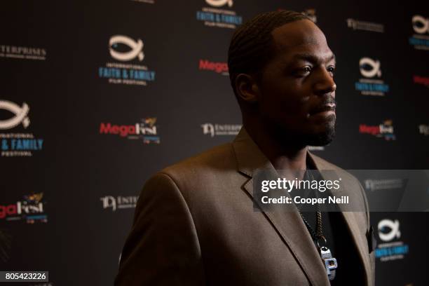 Stallings visits with the media poses before a screening of 'A Question of Faith' during the MegaFest International Faith & Family Film Festival at...