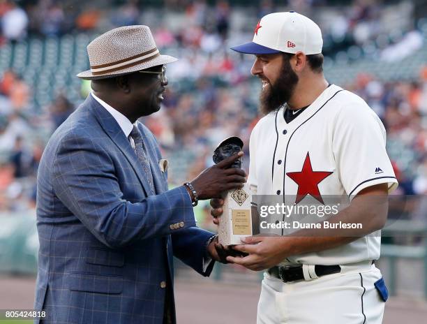 Bob Kendrick, president of the Negro Leagues Baseball Museum, presents Michael Fulmer of the Detroit Tigers with the Larry Doby Legacy Award for...