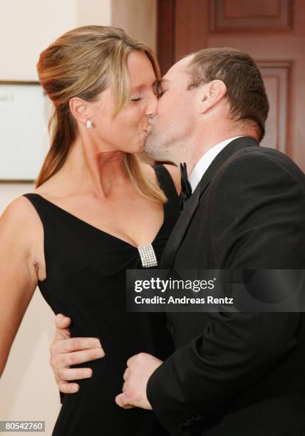 Sven Ottke kisses Monic Frank on their arrival at the Felix Burda award gala at Adlon Hotel on April 6, 2008 in Berlin, Germany.