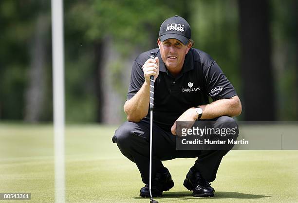 Phil Mickelson lines up his putt on the 13th hole during the final round of the Shell Houston Open at Redstone Golf Club on April 6, 2008 in Humble,...