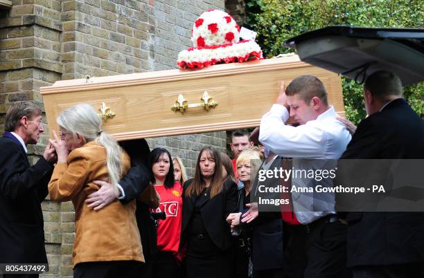 Mother Sharon Hamilton watches as the coffin of her son 10-year-old Sean Hamilton is carried into Our Lady's Church, York.