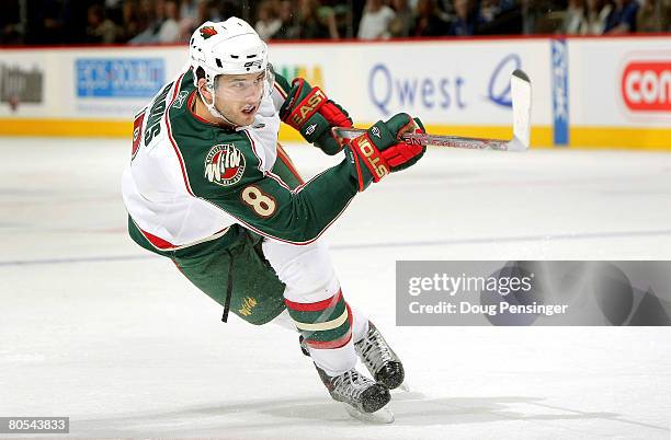 Brent Burns of the Minnesota Wild takes a shot against the Colorado Avalanche at the Pepsi Center on April 6, 2008 in Denver, Colorado.