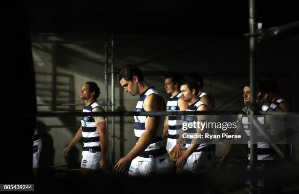 Tom Hawkins and Patrick Dangerfield of the Cats lead their team out during the round 15 AFL match between the Greater Western Sydney Giants and the...