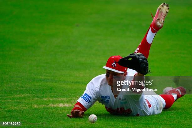 Jose Urena of Diablos fail to catch the ball during the match between Rojos del Aguila and Diablos Rojos as part of the Liga Mexicana de Beisbol at...