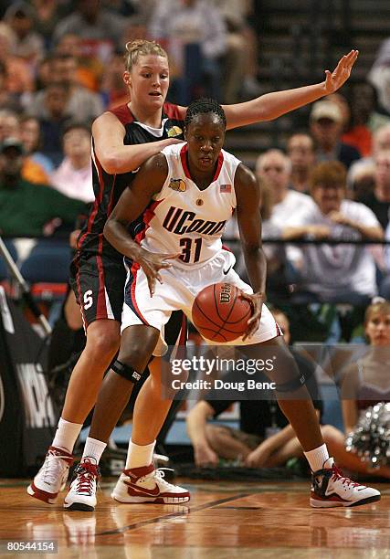 Tina Charles of the UCONN Huskies posts up in the first half against Jayne Appel of the Stanford Cardinal during their National Semifinal Game of the...