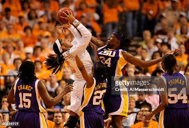 Candace Parker of the Tennessee Lady Volunteers attempts a shot in the second half against Sylvia Fowles, Allison Hightower, Quianna Chaney and...