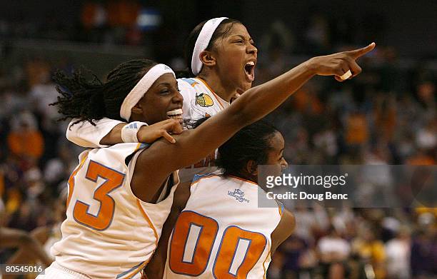 Alberta Auguste, Candace Parker and Shannon Bobbitt of the Tennessee Lady Volunteers celebrate their 47-46 win against the LSU Lady Tigers during...