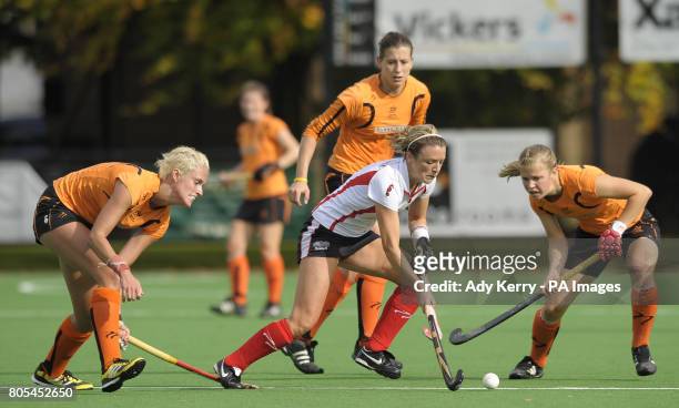 Bowdon's Nicky O'Donnell battles with Leicester's Lauren Turner and Lucy Brown during their EHL Premier League game at Bowdon HC, Manchester