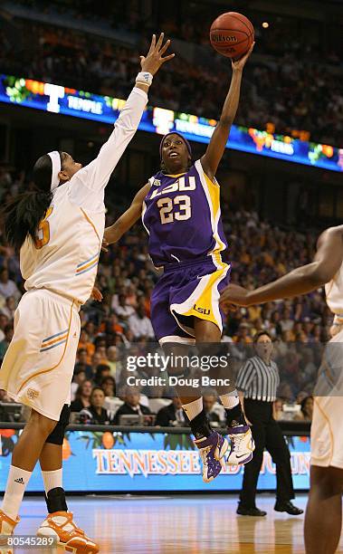 Allison Hightower of the LSU Lady Tigers drives for a shot attempt Candace Parker of the Tennessee Lady Volunteers during their National Semifinal...