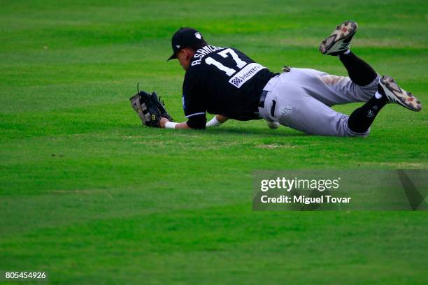 Alan Sanchez of Guerreros fails to catch the ball during the match between Rojos del Aguila and Diablos Rojos as part of the Liga Mexicana de Beisbol...