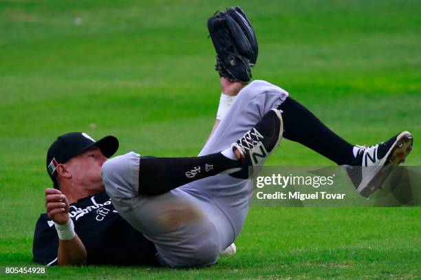 Alan Sanchez of Guerreros fails to catch the ball during the match between Rojos del Aguila and Diablos Rojos as part of the Liga Mexicana de Beisbol...