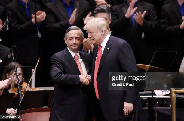 President Donald Trump is greeting by Pastor Robert Jeffress during the Celebrate Freedom Rally at the John F. Kennedy Center for the Performing Arts...