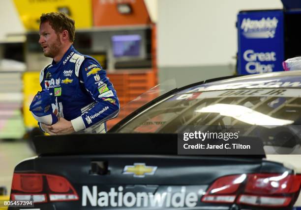 Dale Earnhardt Jr., driver of the Nationwide Chevrolet, reacts in the garage area after being involved in an on-track incident during the Monster...