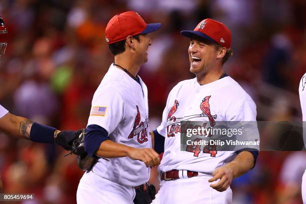 Relievers Matt Bowman and Trevor Rosenthal of the St. Louis Cardinals celebrate after beating the Washington Nationals at Busch Stadium on July 1,...