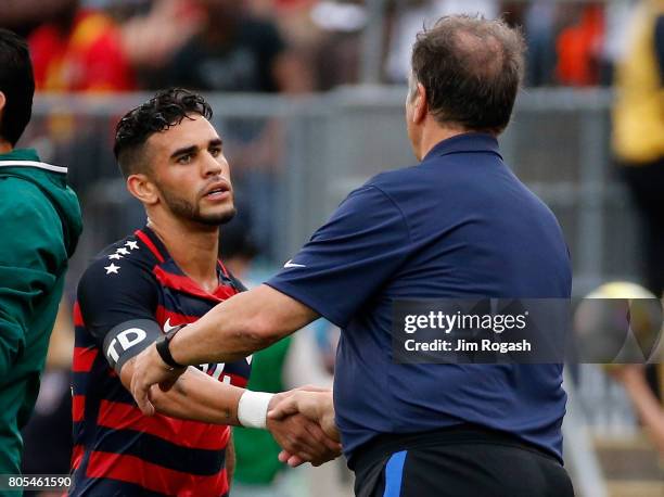 Bruce Arena, head coach of United States, shakes hands with Dom Dwyer in the second half during an international friendly between USA and Ghana at...