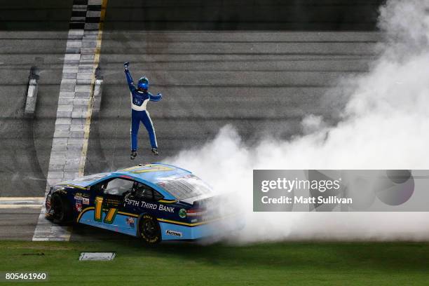 Ricky Stenhouse Jr., driver of the Fifth Third Bank Ford, celebrates winning the Monster Energy NASCAR Cup Series 59th Annual Coke Zero 400 Powered...