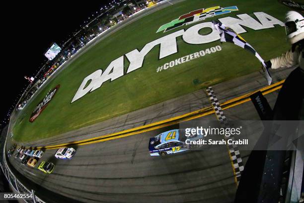 Ricky Stenhouse Jr., driver of the Fifth Third Bank Ford, takes the checkered flag to win the Monster Energy NASCAR Cup Series 59th Annual Coke Zero...