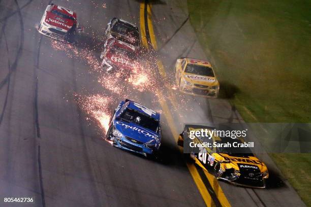 Kyle Larson, driver of the Credit One Bank Chevrolet, and Matt Kenseth, driver of the DEWALT Flexvolt Toyota, are involved in an on-track incident...