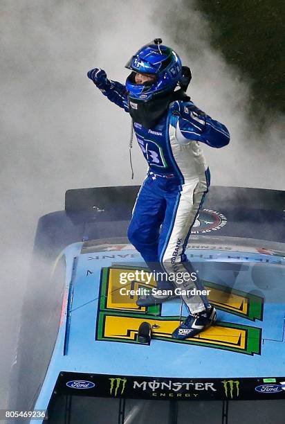 Ricky Stenhouse Jr., driver of the Fifth Third Bank Ford, celebrates winning the Monster Energy NASCAR Cup Series 59th Annual Coke Zero 400 Powered...