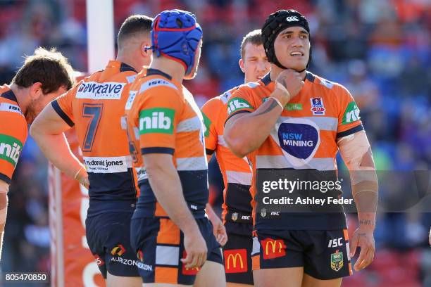 Knights players look dejected after conceding a try during the round 17 NRL match between the Newcastle Knights and the Wests TIgers at McDonald...