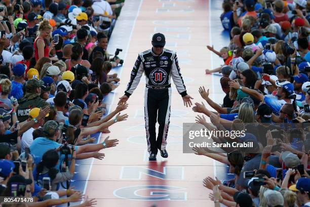 Kevin Harvick, driver of the Jimmy John's Ford, shakes hands with fans before the Monster Energy NASCAR Cup Series 59th Annual Coke Zero 400 Powered...