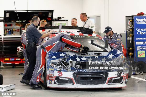 The American Ethanol Chevrolet, driven by Austin Dillon ,, is seen in the garage area after being involved in an on-track incident during the Monster...