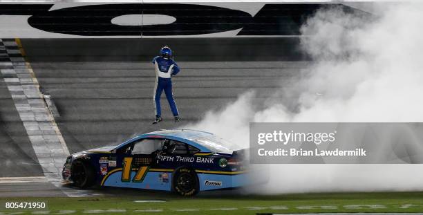 Ricky Stenhouse Jr., driver of the Fifth Third Bank Ford, celebrates winning the Monster Energy NASCAR Cup Series 59th Annual Coke Zero 400 Powered...